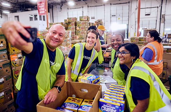 McKesson workers in a warehouse taking a picture