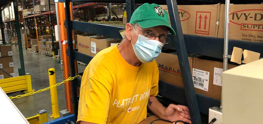 A man operating a forklift in a McKesson distribution center