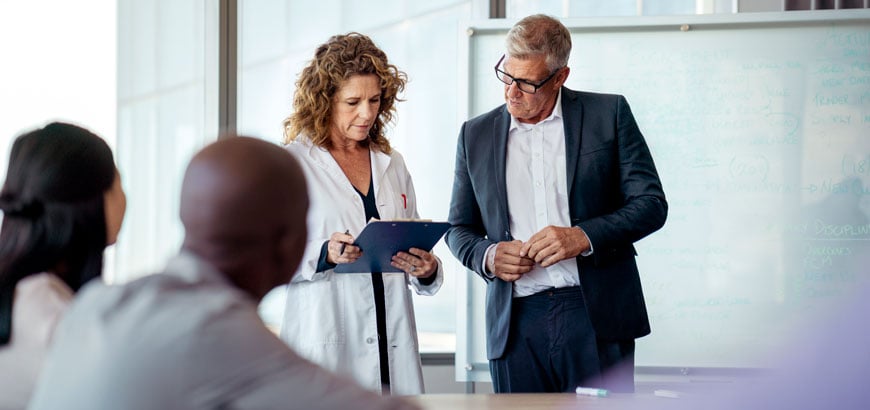 Group of healthcare professionals having a meeting in a conference room.