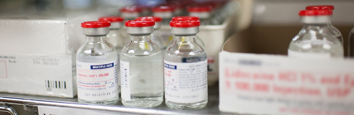 close up of bottles of medication on a shelf