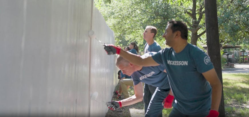 People painting a wall