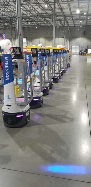 <span>Locus Robots lined up inside a McKesson Distribution center</span>