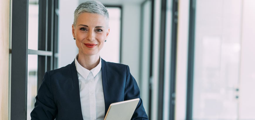 A business woman holding a tablet